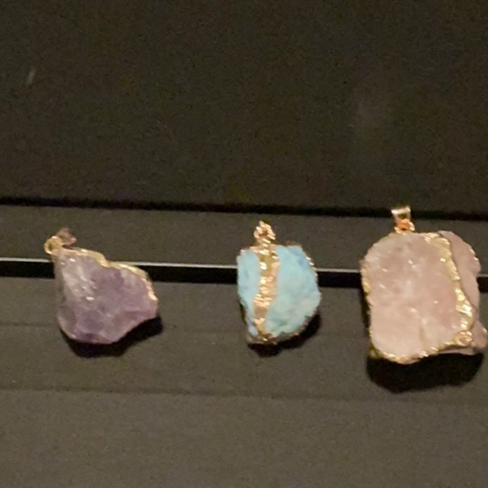 Natural raw crystals gemstones pendants .